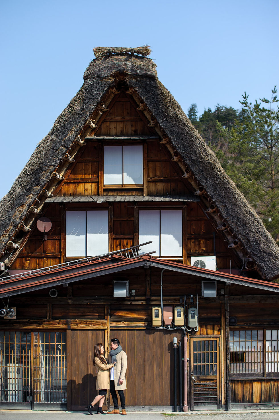 Vivi and Mika with a gorgeous view of a gassho house