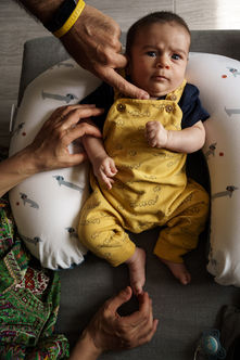 baby and his parents' hands