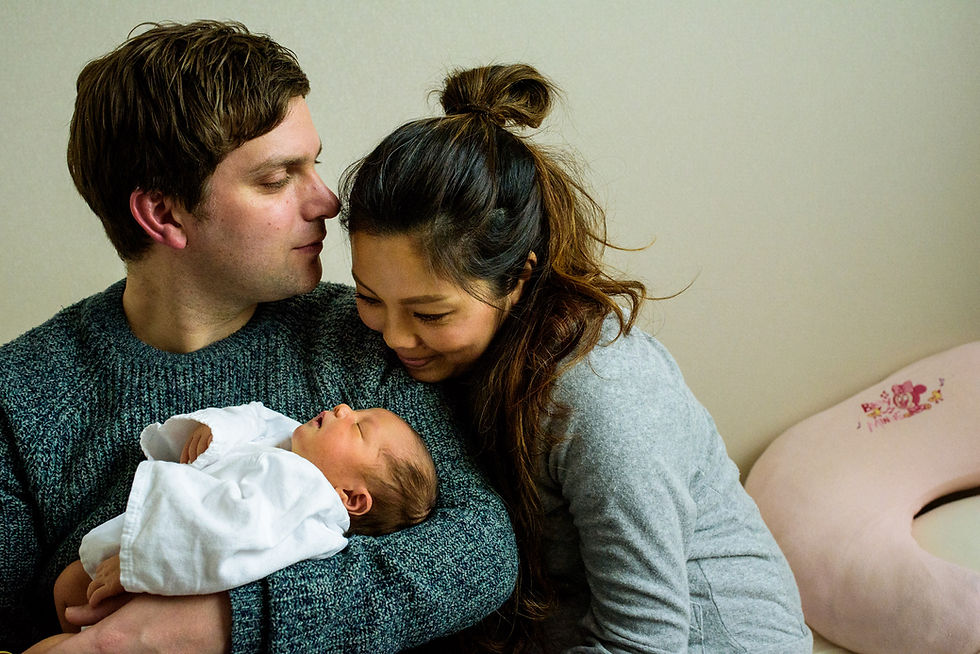 Family of three, Charlie looking adoringly at his wife
