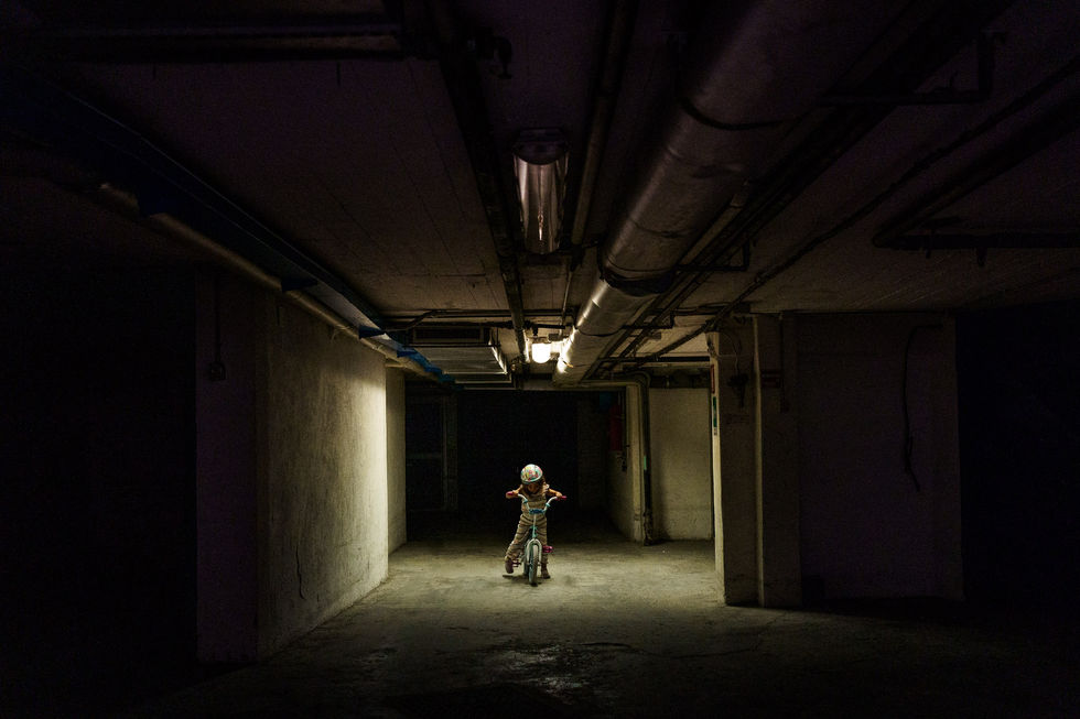 girl on her bike in the garage