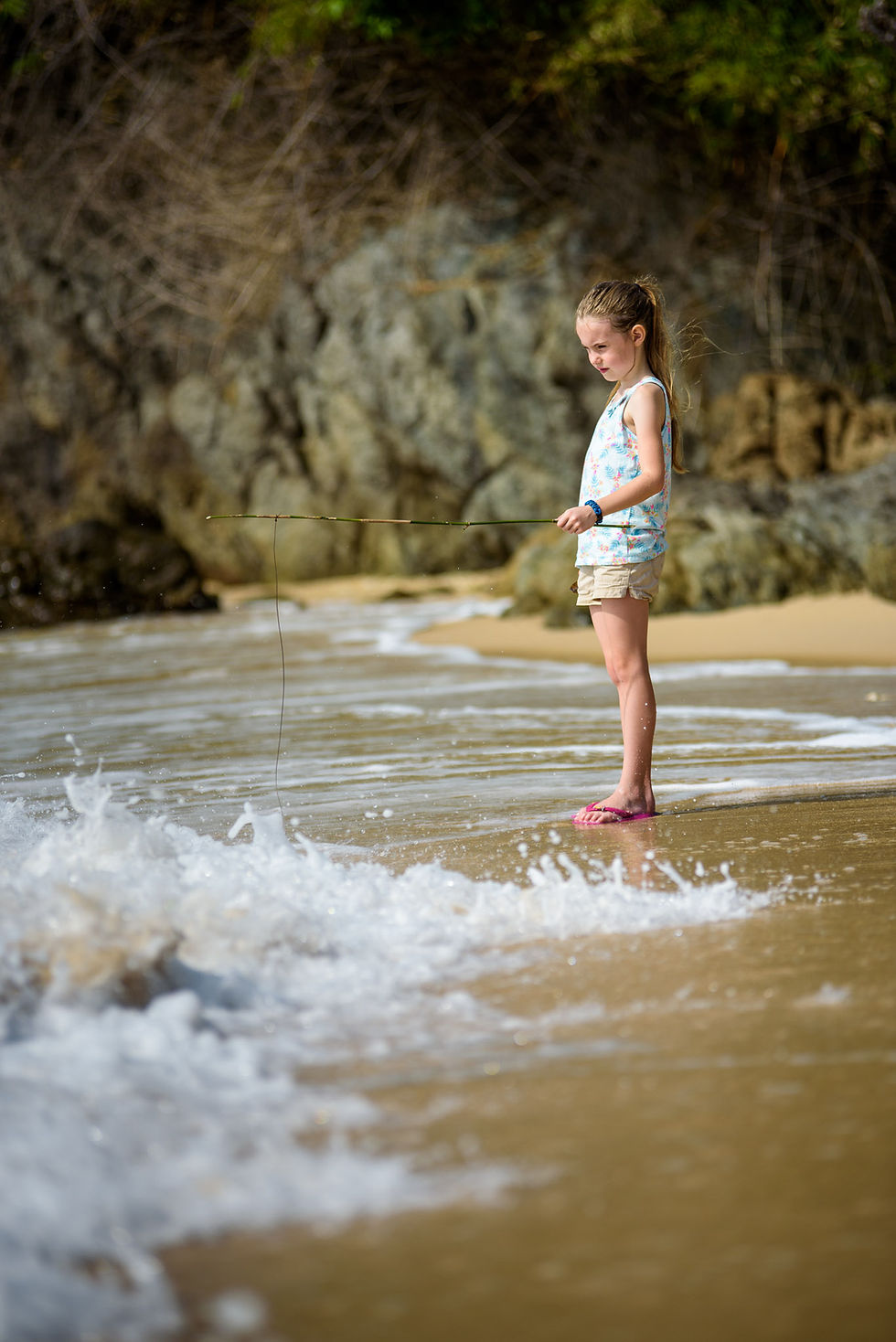 Amelia fishes with a stick