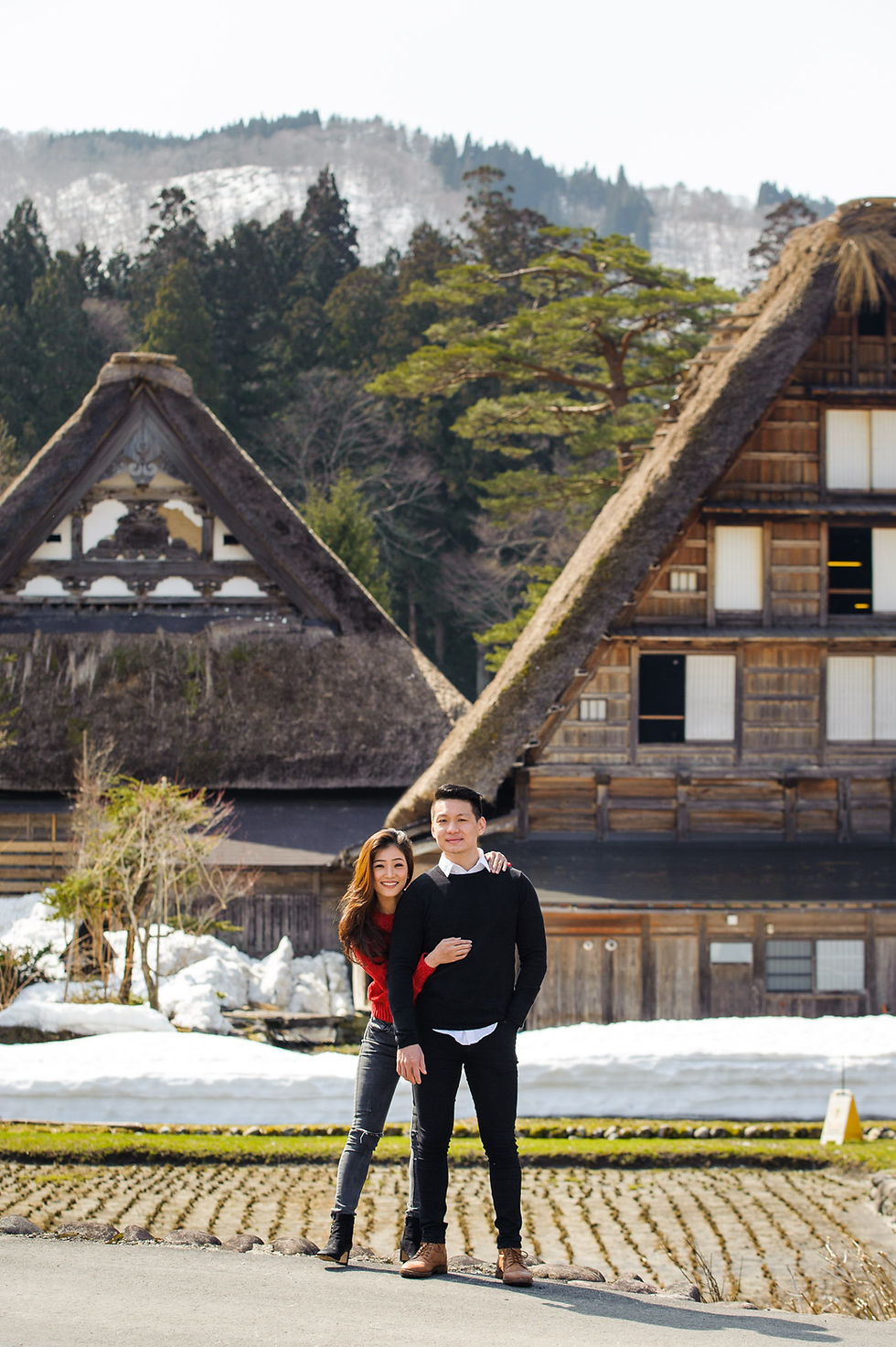 Vivi and Mika and grass roofs pointing down at them