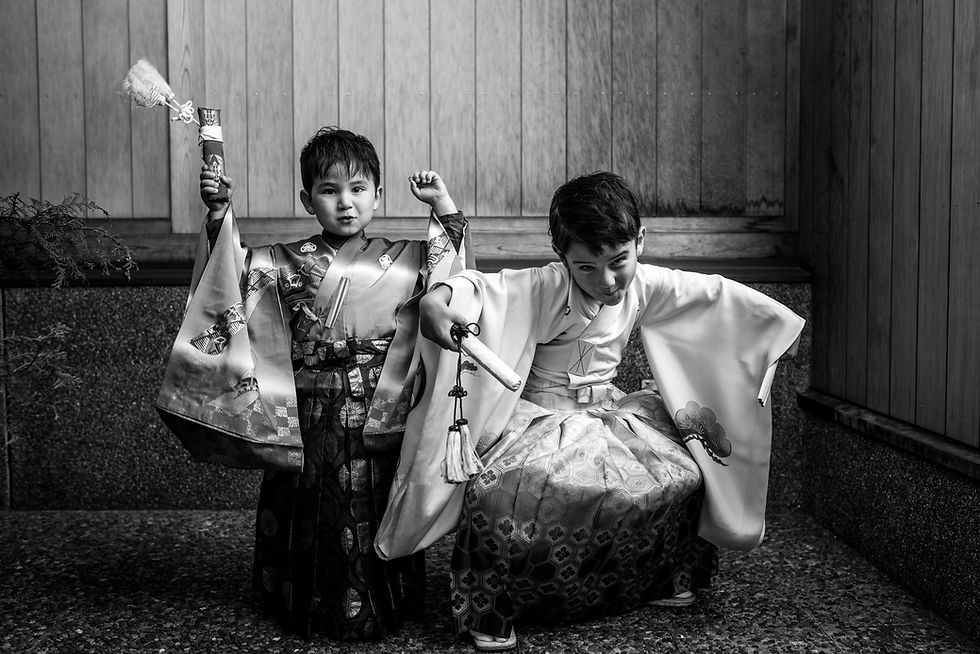 Roma and Taiga show their muscles while posing in their kimonos
