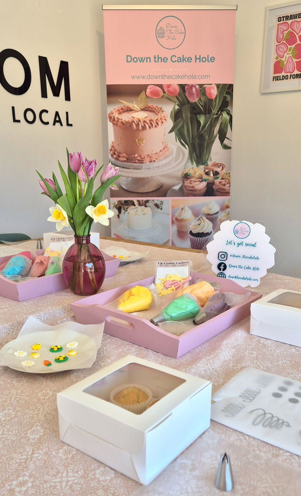 Wide angle view of The Workroom at Love Local filled with cupcake decorating supplies