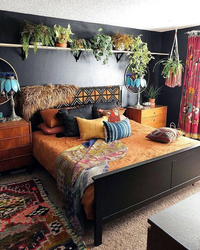 african boho bedroom with black accent wall