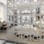 Separating rooms without walls in a studio apartment using modular wall panels screen.