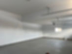 An empty room with white walls and roof
