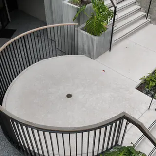Curving concrete stairs and plaza at 190 Newport Center Dr