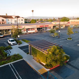 Aerial view of Carson Plaza shopping center parking lot.