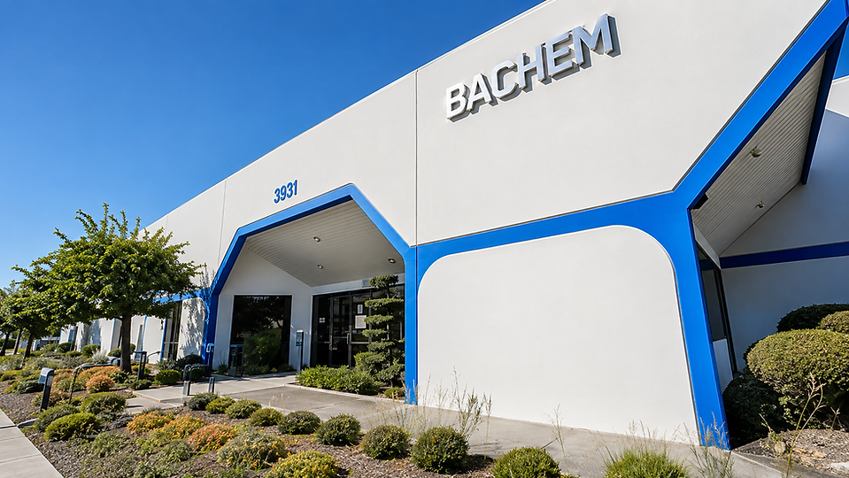 Exterior of the Bachem building with blue trim.