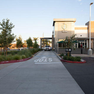 Drive-thru lane at a modern commercial building.