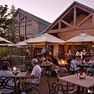 Guests dining on the outdoor patio at Tenaya Lodge.