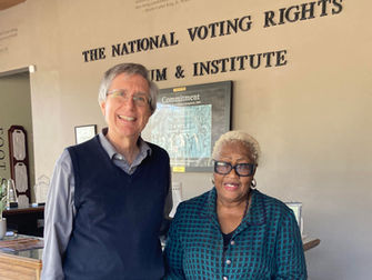 Tom Faletti and Betty Boynton stand next to each other, smiling, at the National Voting Rights Museum and Institute, Selma, AL.