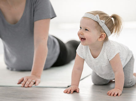 Mother and toddler on yoga mat.png