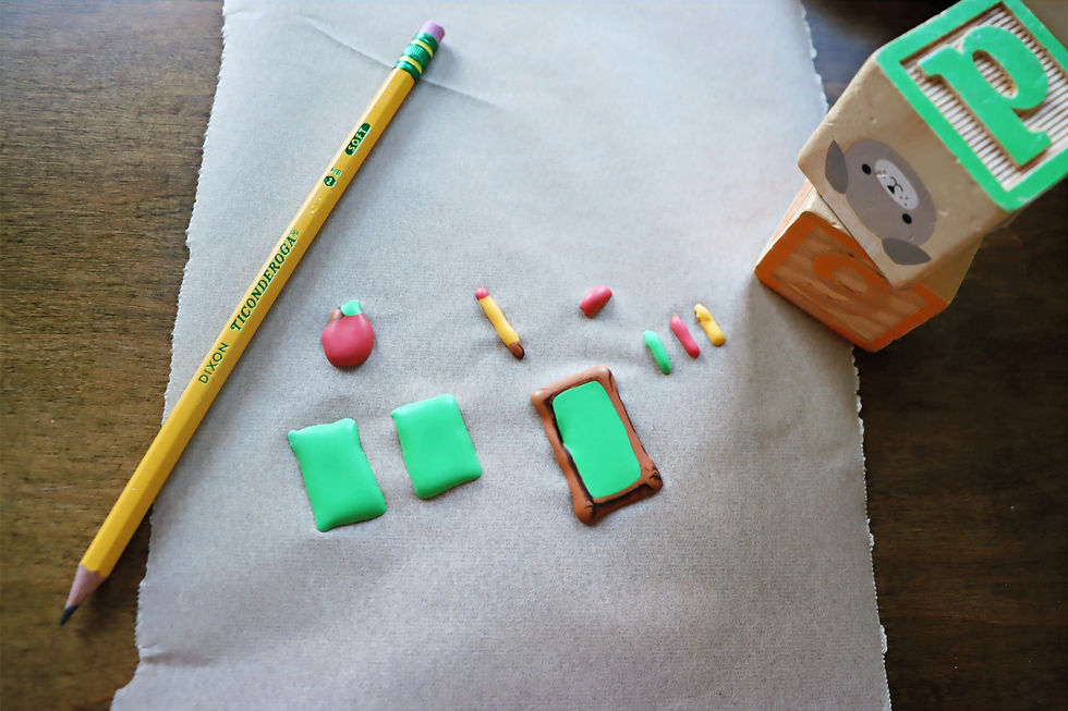 Colorful homeschool-themed sugar cookies designed like alphabet blocks and school supplies.