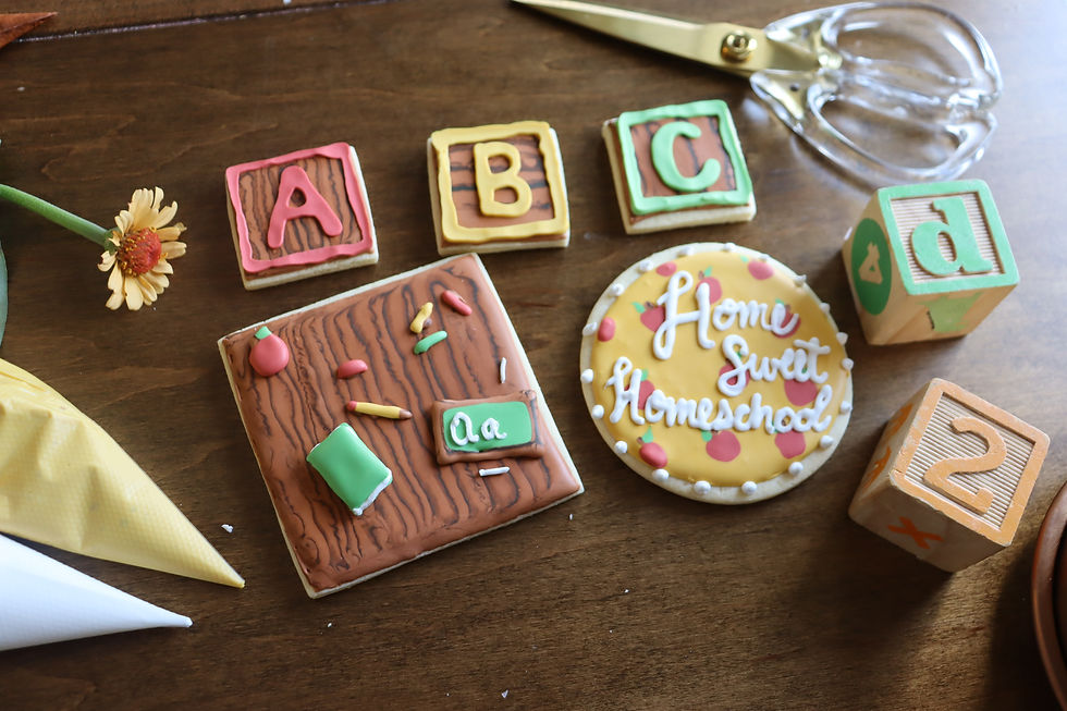 Educational-themed cookies shaped and decorated like wooden toys and classroom items for students
