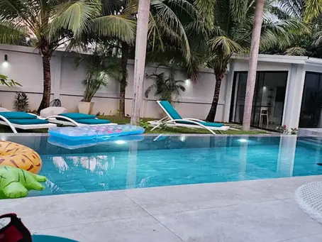 Private swimming pool with toys and inflatables for kids in a Samui villa