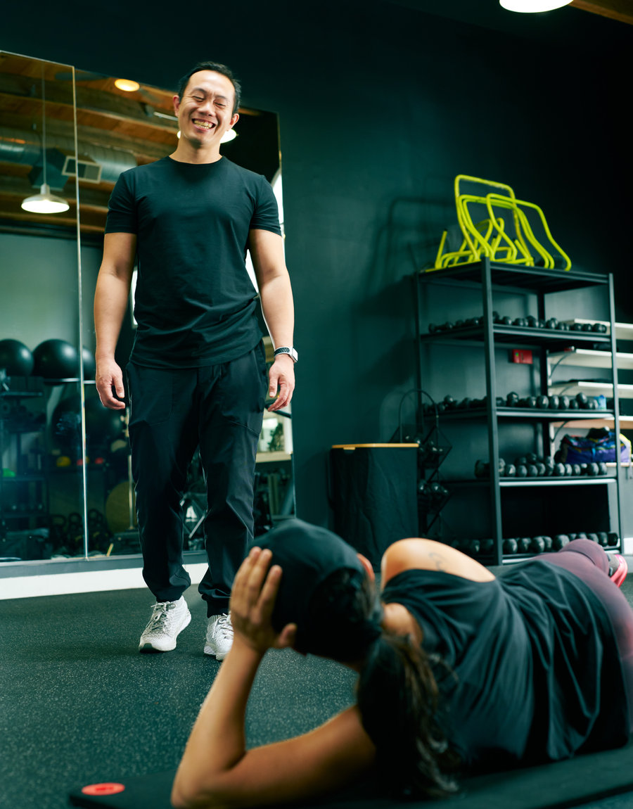 Chris Lee guiding a client through a personal training session