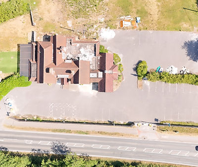 Aerial drone photograph of former pub and development site in Weyhill near Andover