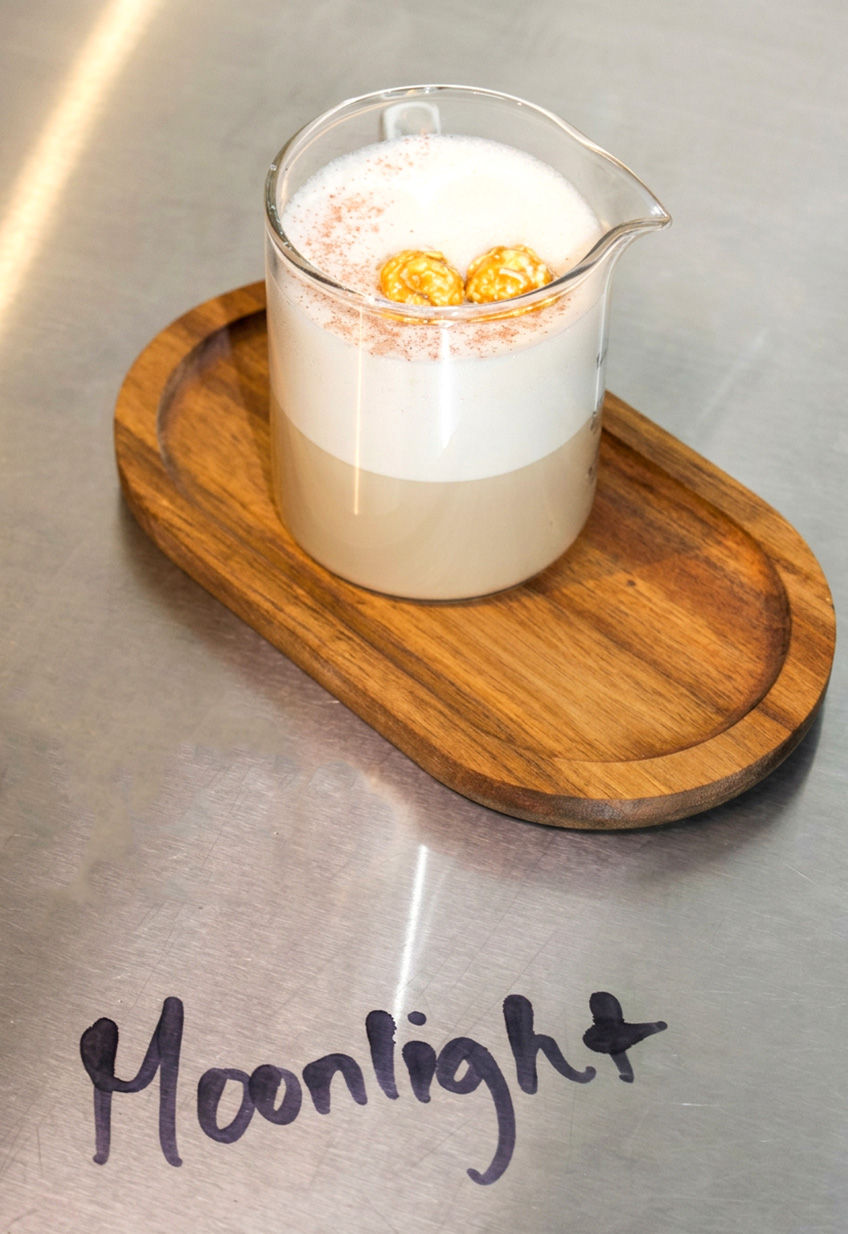 Moonlight menstrual support latte topped with pink pepper and popcorn at Happy Tea