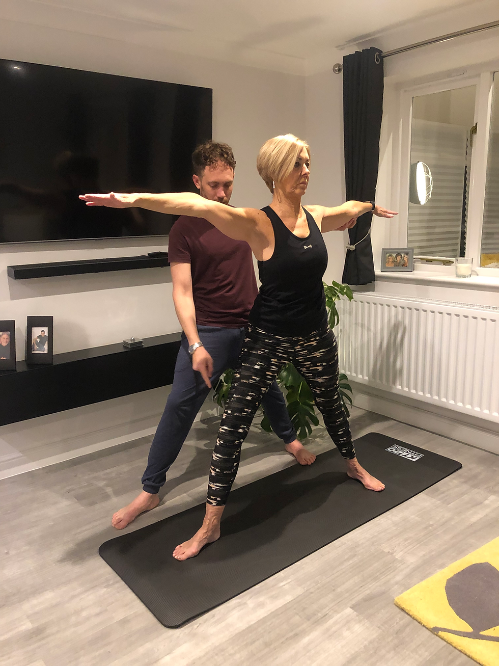 Noel demonstrating a beginner-friendly yoga pose in Stoke-on-Trent