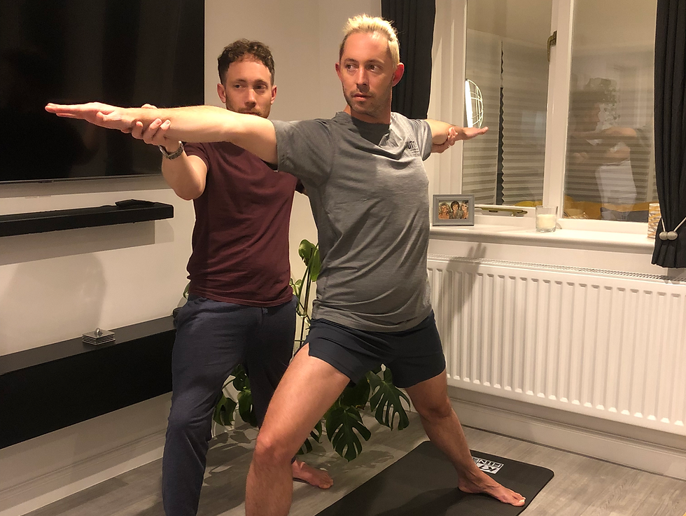 Noel welcoming a student to their first yoga class in Fulford, Stoke-on-Trent