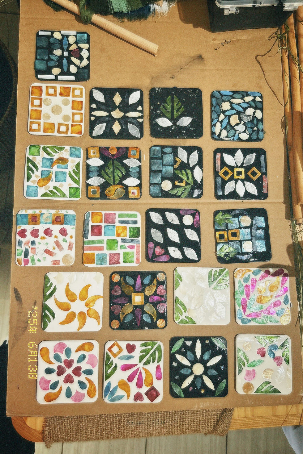 A vibrant sea of finished coasters—each one a handmade expression of patience, play, and personal style.