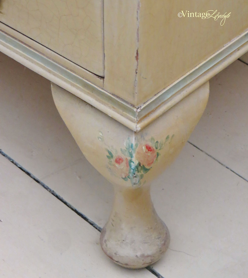 Thumbnail: Detail of hand painted roses on legs of 1930's drawers