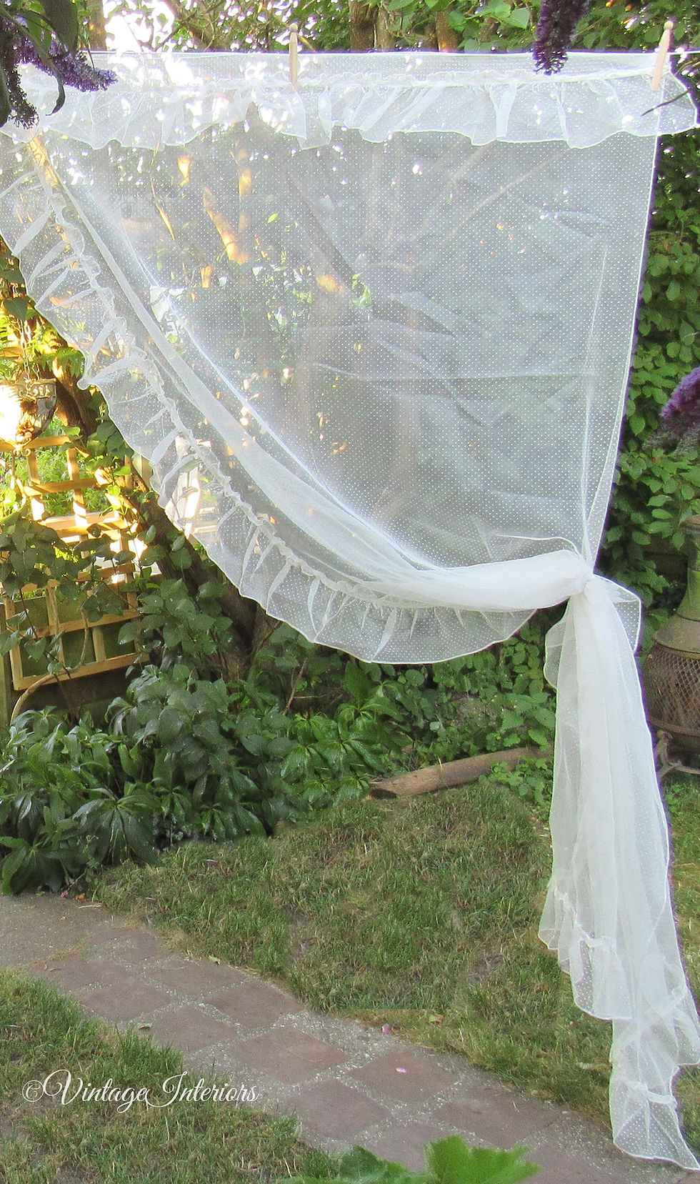 Thumbnail: Ruffled swiss dot vintage curtains tie back