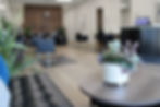 view of refinery salon inside from client lounge to backwash bowls, plants open view