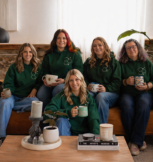 5 female trauma therapists in green hoodies sitting on a couch in therapy for officers in Ontario