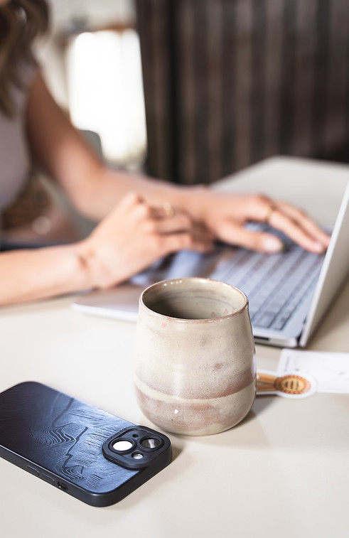 An EMDR therapist typing on a laptop during online therapy for couples in Ontario