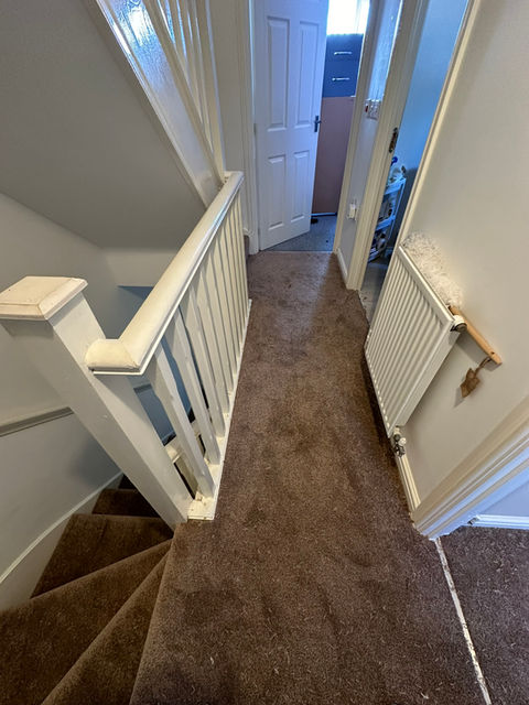 brown carpet on landing and stairs