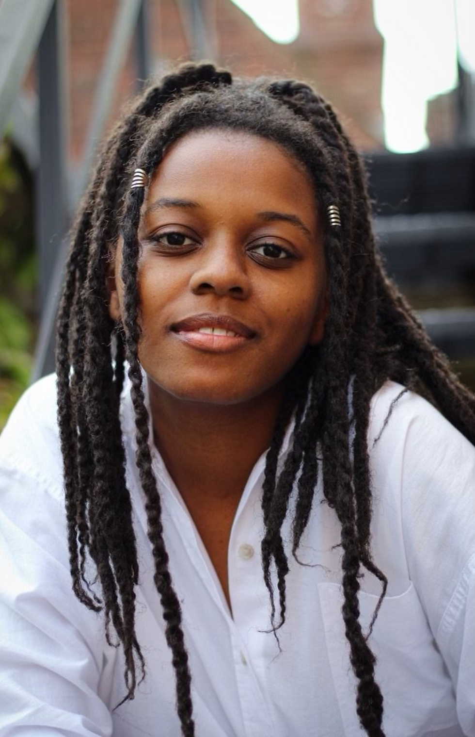 Alexis Kulani Woodard headshot.png