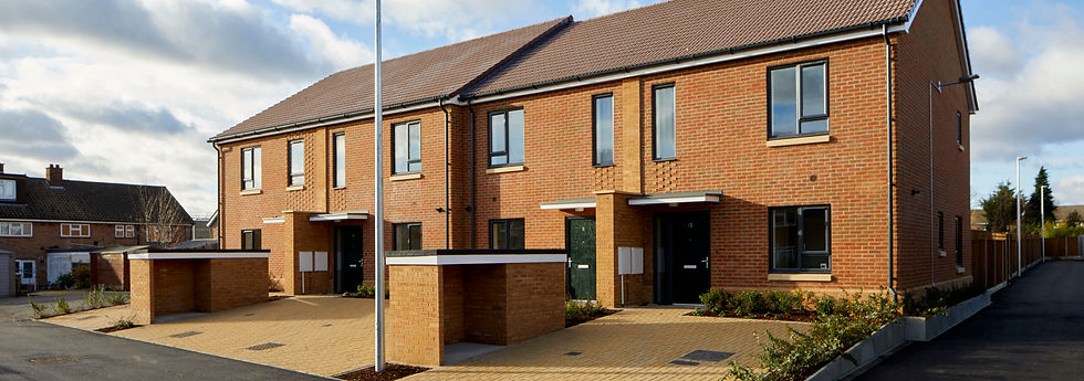 Family housing with driveway binstores gardens detailed brick modern design sustainable