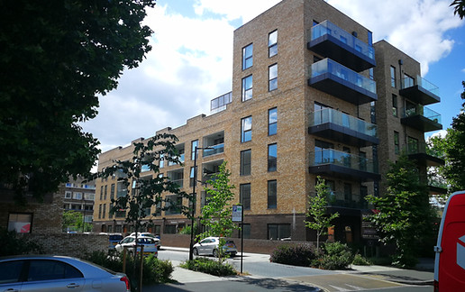 Estate redevelopment london brownfield buff brick yellow brick curtain wall apartment block balcony