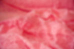 peachy pink lace fabric swirled