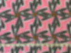 pink black and brown pinwheel fabric with a tape measure