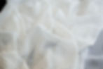 silk chiffon dot fabric piled up high