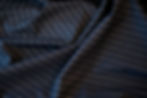 wool and lycra navy and ivory pinstripe fabric swirled