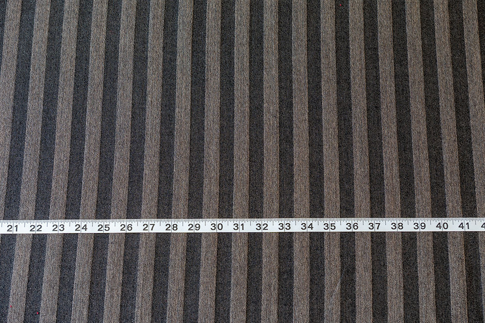 Thumbnail: black and tan wool fabric with tape measure