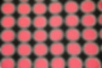 coral pink, black and white circle fabric closeup