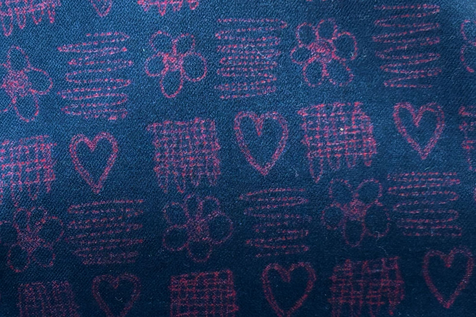 pink line drawn hearts and flowers with squiggles on a dark teal blue velvet fabric