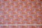 rust floral cotton fabric with tape measure