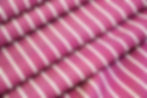 hot pink and white cotton shirting fabric folded