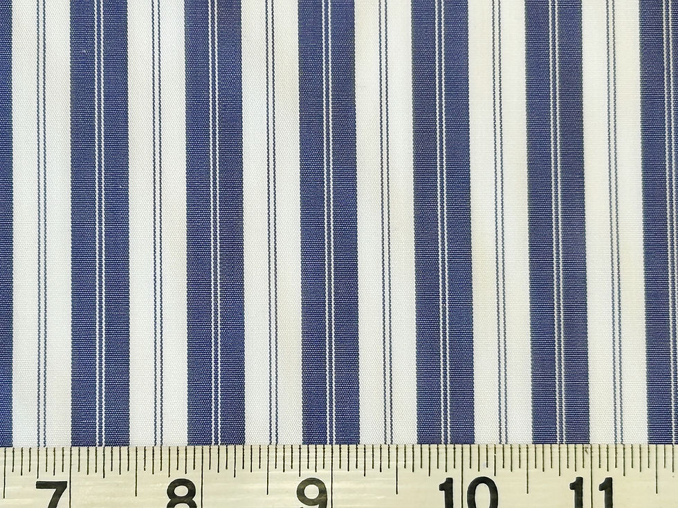 blue and white multi stripe fabric with a tape measure