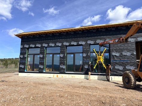 large modern windows being installed by Unshakeable Custom Homes, a custom home builder in Star Valley, Wyoming.