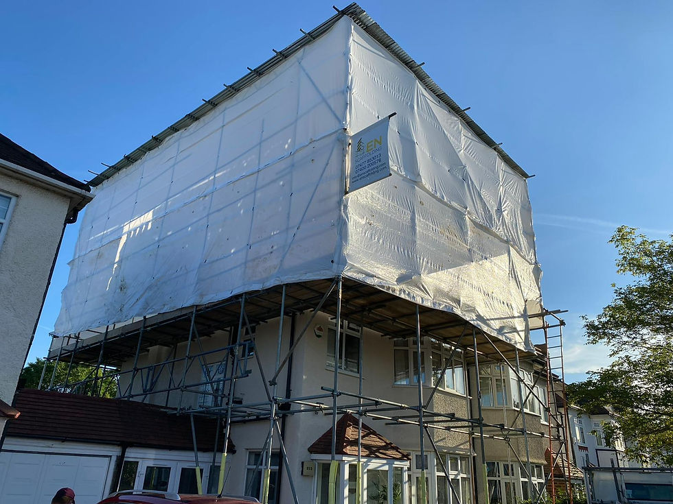 Full building wrap scaffolding with temporary weather protection roof