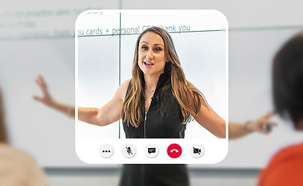 A photo of revenue strategist Abbie White, creator of the REV UP System, delivering a sales and GTM enablement workshop.