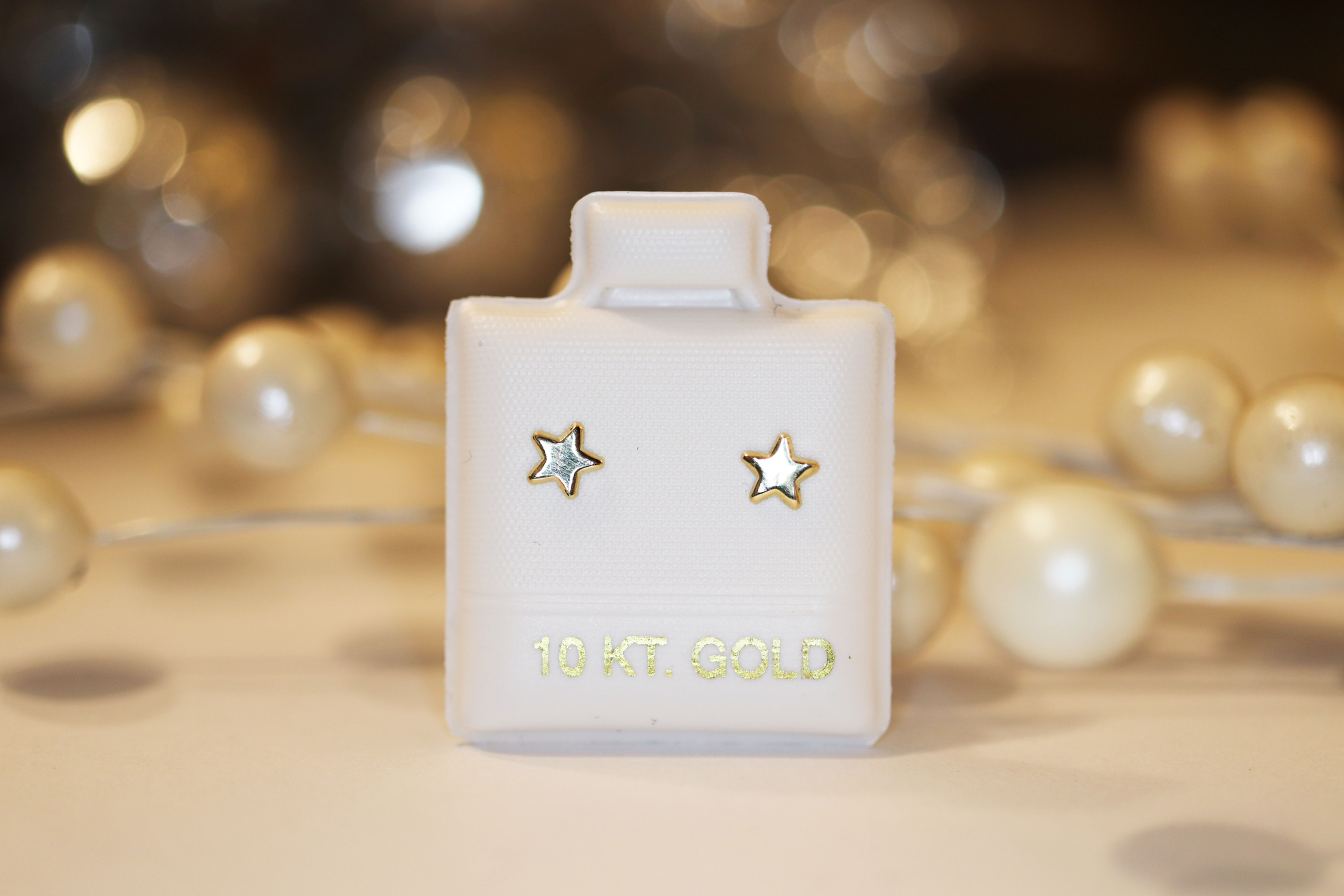 BOA20 Broquel Estrellita Mini lisa Oro 10K